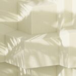 Geometric blocks with palm tree shadow.